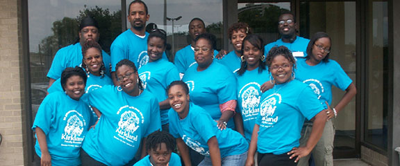 Happy family wearing matching custom reunion t-shirts